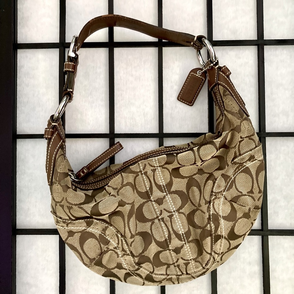 Half moon Coach purse w/ buckle accent